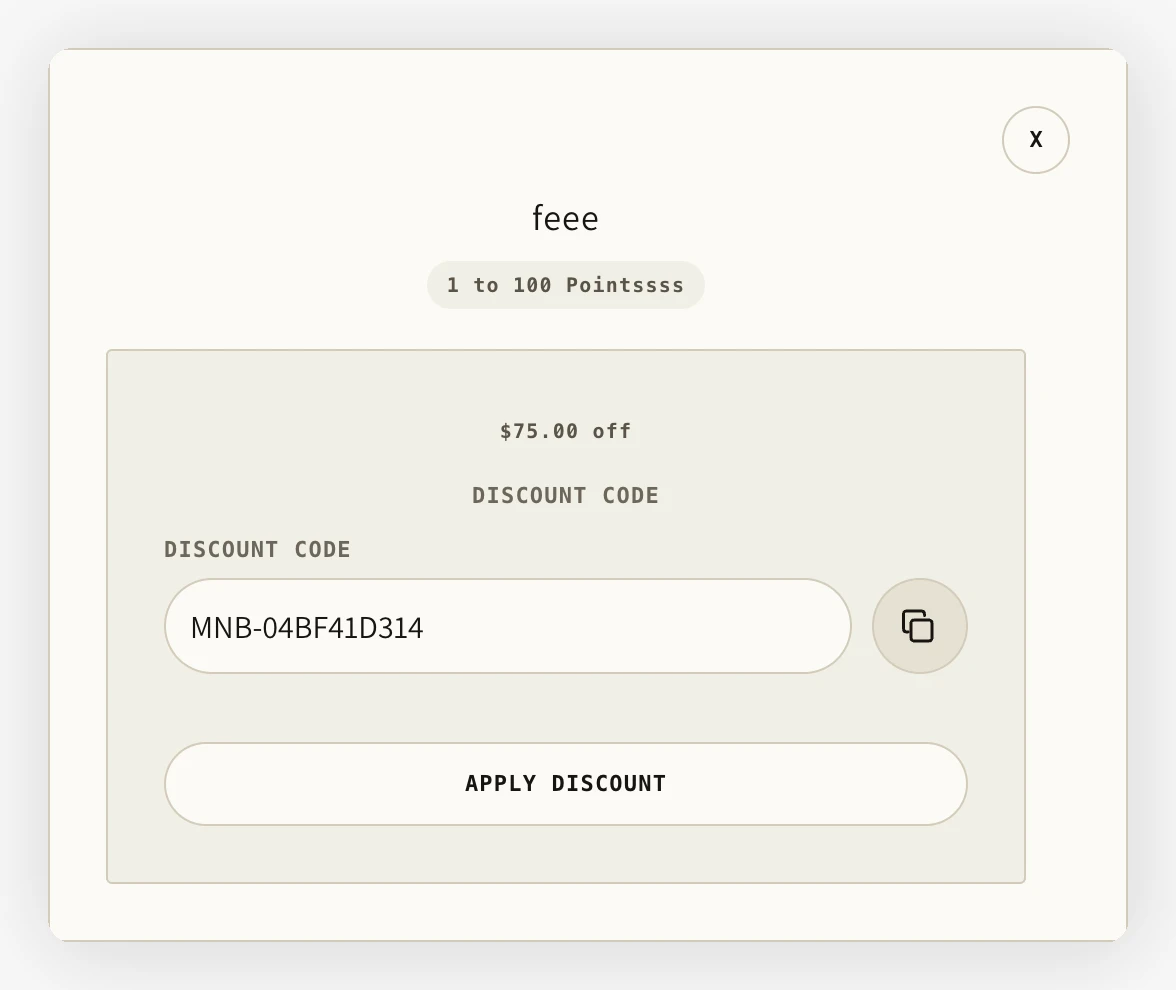 Recompensa canjeada en Loyalty Hub con un código de descuento de 75 $, control para copiar y botón Apply discount
